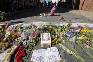 A makeshift memorial of flowers and a photo of victim Heather Heyer sits in Charlottesville, Virginia, Aug. 13. Heyer died when a car rammed into a group of people who were protesting the presence of white supremacists who had gathered in the city for a rally.