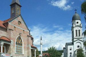 A Catholic church, a mosque and a Serbian Orthodox church in Bosanska Krupa, Bosnia and Herzegovina. 