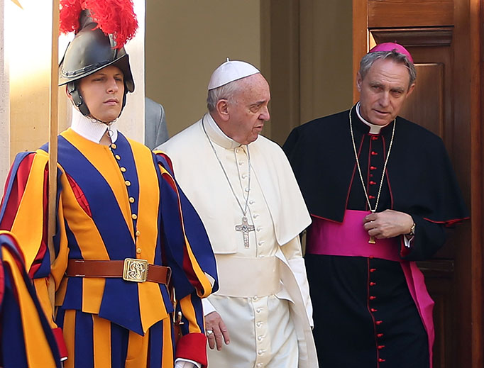 Pope Francis and Archbishop Georg Gänswein arrive at the Paul VI Hall on May 10, 2015 in Vatican City.
