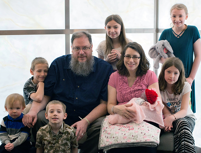 The Smith family: Henry, Cyprian (standing), Abraham, Andrew (Dad), Felicity (standing), Jacquelyn (Mom) holding Gemma, Lucy and Cecilia (standing).