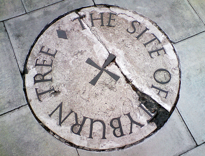 The stone commemorating the Tyburn site on the traffic island at the junction of Edgware Road and Marble Arch in London.