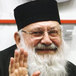 Cardinal Lubomyr Husar of Kiev-Halych, head of the Ukrainian Catholic Church, waves as he leaves a news conference in Kiev Feb. 10, the same day as Pope Benedict XVI accepted his resignation. 