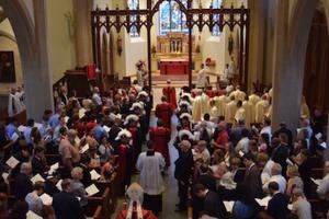 Above, a Pontifical Solemn Mass for the Personal Ordinariate of the Chair of St. Peter; below, Bishop Steven Lopes ordains priests.