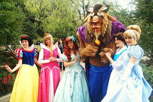 Actresses portraying Snow White, Aurora, Ariel, the Beast, Belle and Cinderella at Disneyland in California.