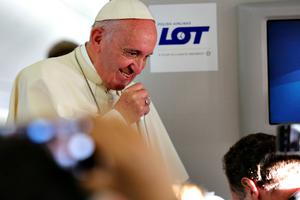 Pope Francis speaks to journalists during a press conference on the papal flight to Rome from Krakow, Poland on July 31.