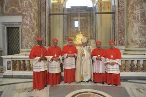Pope Francis with the five new cardinals.