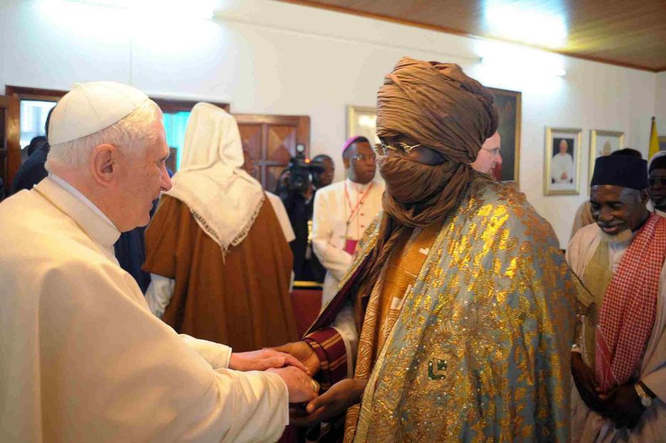 The Pope greets members of Cameroon's Muslim community March 19.