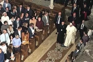 Above, Pope Francis comes to speak to young married couples in St. Mary's Pro-Cathedral in Dublin Aug. 25. Below, parents with babies listen to the Pope at the cathedral.