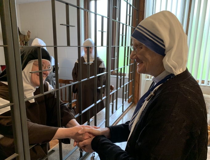 Sister M. Prema, superior general of the Missionaries of Charity, meets Mother M. Therese, superior of the Cloistered Carmelites.