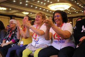 Carmen Ciriaco and Dr. Perla Indarte of Brooklyn and Mayra Reyes of Santa Fe cheer during a ‘V Encuentro’ session.