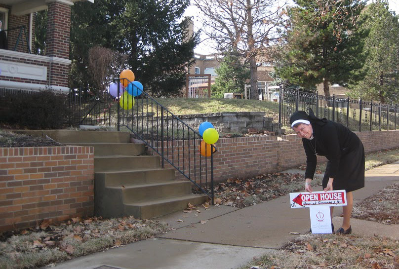 A sister of the Apostles of the Sacred Heart of Jesus gets ready to welcome visitors to the order's open-house event.
