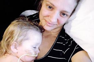Joy Loboda in her mother's arms