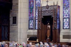 Pictures of parishioners are placed on the pews as Father Brian Needles delivers Easter Sunday Mass via livestream on April 12 at Our Lady of Sorrows Catholic Church in South Orange, New Jersey. New Jersey is one of the hardest-hit states from COVID-19. 