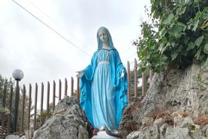 Above, a statue of Oum El Nour (‘Mother of Light’) and (below) the Oum El Nour center. Also shown, former addicts work in the product-packaging workshop at the Message De Paix center in Bikfaya. The center, helped by the Sisters of the Holy Cross, runs programs for both addicts who have gone through the rehabilitation program at the Oum El Nour Rehabilitation and Drug Prevention Center and for the handicapped. Oum El Nour aims to help the former addicts require the appropriate skills to re-enter society and the workplace. Also shown: A young resident of Oum El Nour helps prepare lunch for fellow residents. 