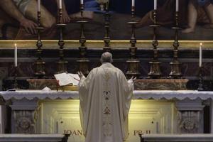 Pope Francis celebrates Mass at the tomb of St. John Paul II in St. Peter’s Basilica May 18, 2020. 