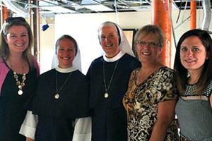 Members of the Sisters for Life visit with the Bella team at the clinic's future location on June 16. 