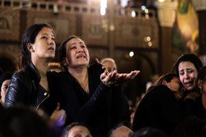 Women cry during the April 10 funeral for those killed in a Palm Sunday church attack in Alexandria, Egypt, at the Mar Amina Church. Egyptian Christians were burying their dead on Monday, a day after Islamic State suicide bombers killed at least 45 people in coordinated attacks targeting Palm Sunday services in two cities. Women wailed as caskets marked with the word ‘martyr’ were brought into the church in the coastal city of Alexandria, the footage broadcast on several Egyptian channels.