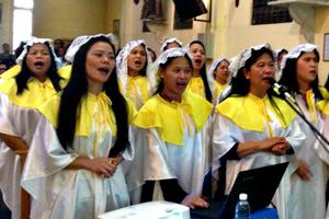 Filipino workers comprise the majority of communicants at St. Francis Church in Beirut, Lebanon. Top to bottom: the choir sings at Mass, which is always crowded; a post-Mass photo in front of church; and a group praying for the Blessed Mother's intercession after Mass.