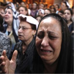 A Coptic Christian woman cries during a prayer service at a church in Cairo May 8. The church was set on fire later that evening during clashes between Muslims and Christians. At least 12 people were killed during the violence.