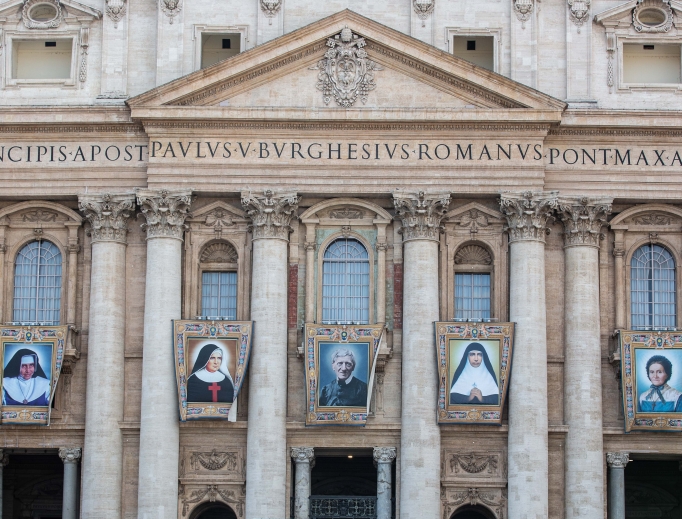 The official canonization banners of the five new saints hang in St. Peter's Square.