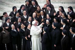 Pope Francis greets a group of sisters during his weekly audience at the Paul VI Hall Jan. 15.