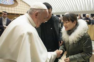Pope Francis greets a woman after his weekly General Audience, January 8, 2020. 