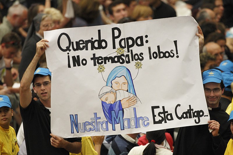 Pilgrims hold a sign of support for Pope Benedict XVI prior to the start of the pontiff's general audience in Paul VI hall at the Vatican June 23. The sign in Spanish says: "Dear Pope: Don't fear the wolves! Our Mother is with you."