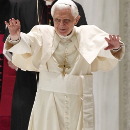 Pope Benedict XVI waves as he arrives to lead his general audience in Paul VI hall at the Vatican Feb. 9.