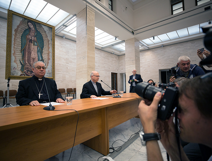 Bishop Fernando Ramos, auxiliary bishop of Santiago, and Bishop Juan Ignacio González of San Bernardo, a member of Chile's national commission for the protection of minors, at a press conference on May 18, 2018 announcing the resignation of all 34 Chilean bishops at the close of their 3-day meeting with Pope Francis in Vatican City.