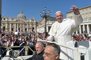 Pope Francis waves to the faithful after celebrating a Mass for the opening of the youth-focused Synod of Bishops Oct. 3 in St. Peter’s Square. The synod, which runs through Oct. 28, brings together 266 bishops from five continents. 