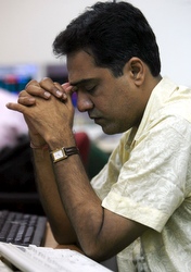 Stockbroker in Mumbai, India, contemplates the global market crash last September.