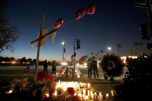 Mourners gather at Inland Regional Center Dec. 4 in San Bernardino, Calif.