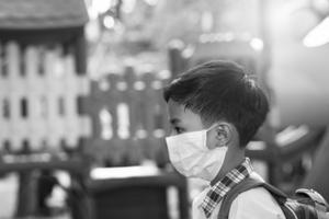 A 5-year old boy wears a face mask amid the coronavirus pandemic. 