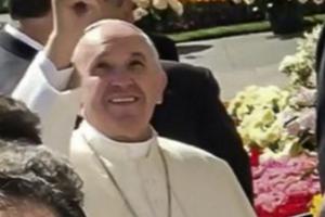 Pope Francis points to heaven after viewing a picture of Mother Angelica during his March 30 general audience, which took place three days her death.