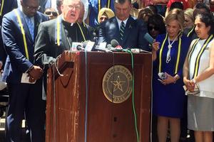 Bishop Kevin Farrell speaks at a prayer vigil July 8 in Dallas.