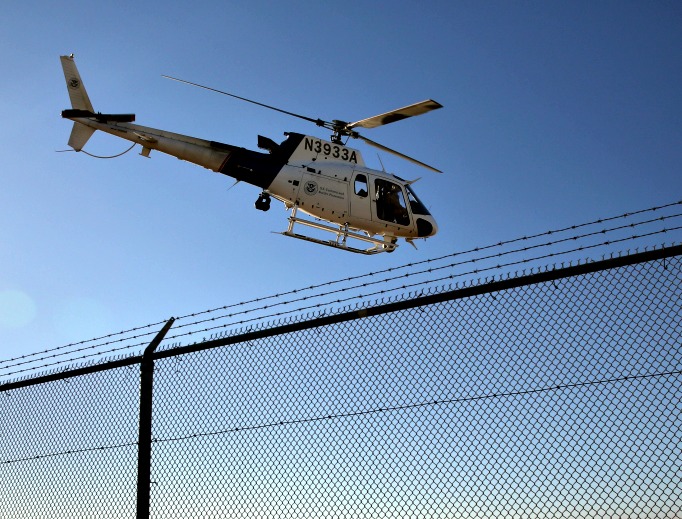 A U.S. Office of Air and Marine (OAM) helicopter patrols near the U.S.-Mexico border in San Diego, California. 
