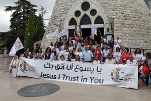 Above, participants in the second Middle East Congress on Divine Mercy (MECOM II) in Lebanon gather at Our Lady of Lebanon, Harissa. Highlights of this month’s congress included a procession with and Mass in the presence of the relics of St. Faustina Kowalska, St. John Paul II and Blessed Father Michael Sopocko, the confessor and spiritual director of St. Faustina. Participants also prayed the Chaplet of Divine Mercy in the Forest of the Cedars of God. Below, congress participants joyfully gather after praying the chaplet near Becharre, Lebanon; and Sisters Lina and Rima Barakat, Syriac Catholic Ephremite Sisters of the Daughters of Mary, Mother of Mercy, from Homs, Syria, also attended. The sisters are twins.