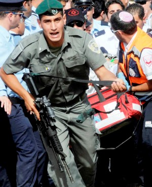 Security with a fainting Nazareth papal pilgrim