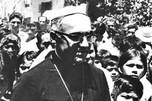 Archbishop Oscar Romero meets with young people in El Salvador in this undated file photo.