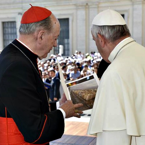 Cardinal Juan Luis Cipriani and Pope Francis in St. Peter’s Square viewing photos from the March for Life in Lima, Peru, on June 3.

