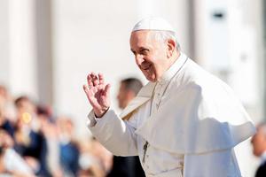 Pope Francis waves to the faithful in St. Peter's Square Sept. 26. 