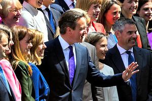 British Prime Minister David Cameron (c) poses for a picture with the new Conservative Party MPs in Palace Yard on May 11 in London.