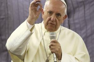 Pope Francis talks with journalists during his flight from Lima, Peru, to Rome Jan. 21.