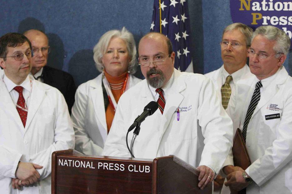 Dr. John Bruchalski, founder of the Tepeyac Family Center in Fairfax, Va., is flanked by other medical professionals as he speaks concerning conscience protection during a press conference at the National Press Club in Washington April 8.