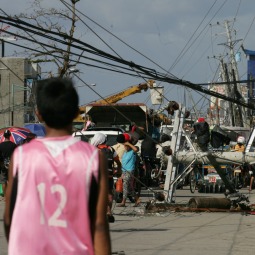 Downed power lines and debris block the road in the aftermath of Typhoon Haiyan on Nov. 10 in Tacloban, Leyte, Philippines.