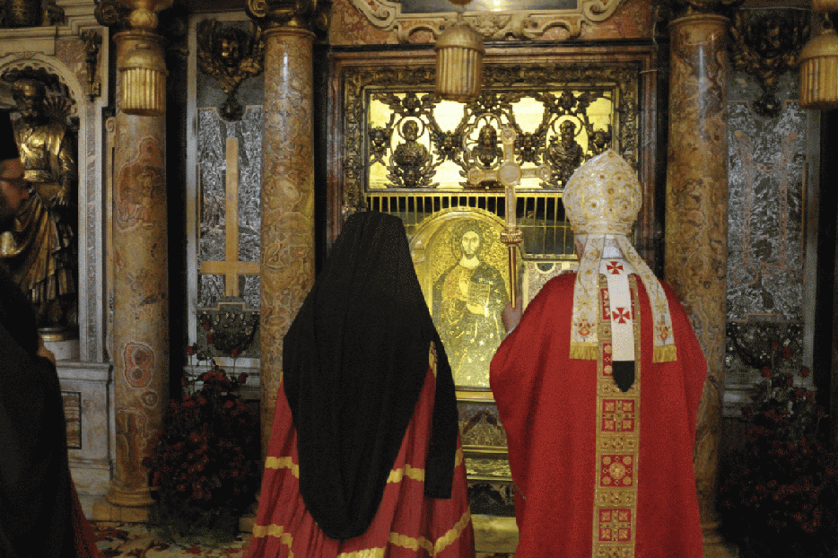 Patriarch Bartholomew I and Pope Benedict XVI at St. Peter's tomb.