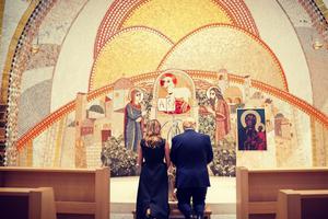 President Donald Trump and first lady Melania Trump kneel in front of a first-class relic of St. John Paul II at the St. John Paul II National Shrine on June 2.