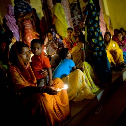 Families attend midnight Mass outside Our Lady Of Charity Church in Raikia, 200 miles south of Bhubaneswar, India.
