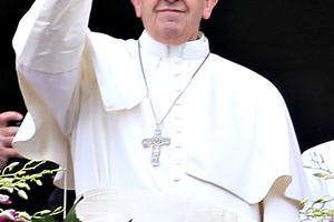 Pope Francis waves to the faithful as he delivers his message and blessing urbi et orbi from the central balcony of St. Peter's Basilica at the end of the Easter Mass. 