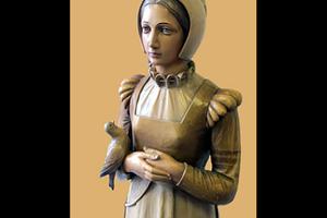 This statue of St. Anne Line stands in St. Anne Line Junior School in Basildon, Essex, England.
